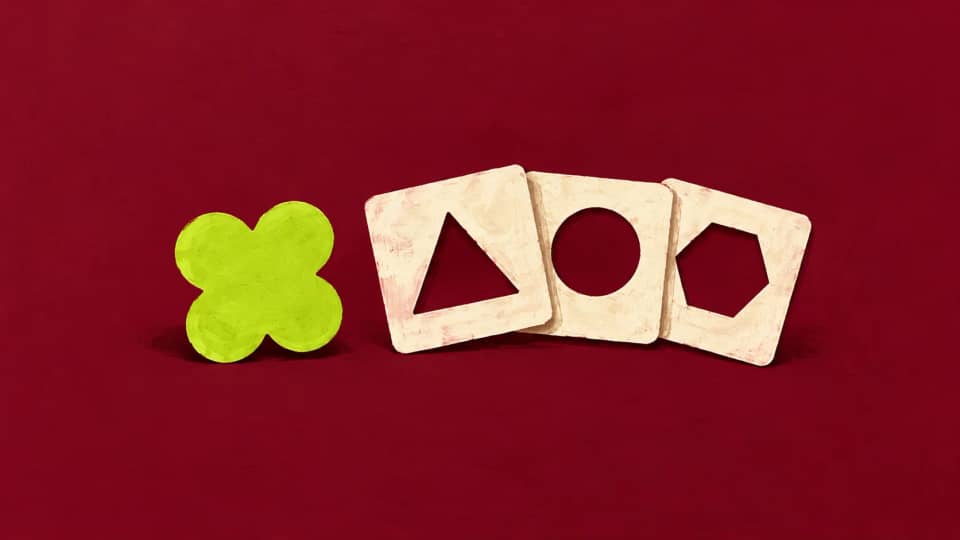 A lime four-lobed shape has no match among three cream stencils with triangle, circle and hexagon openings.