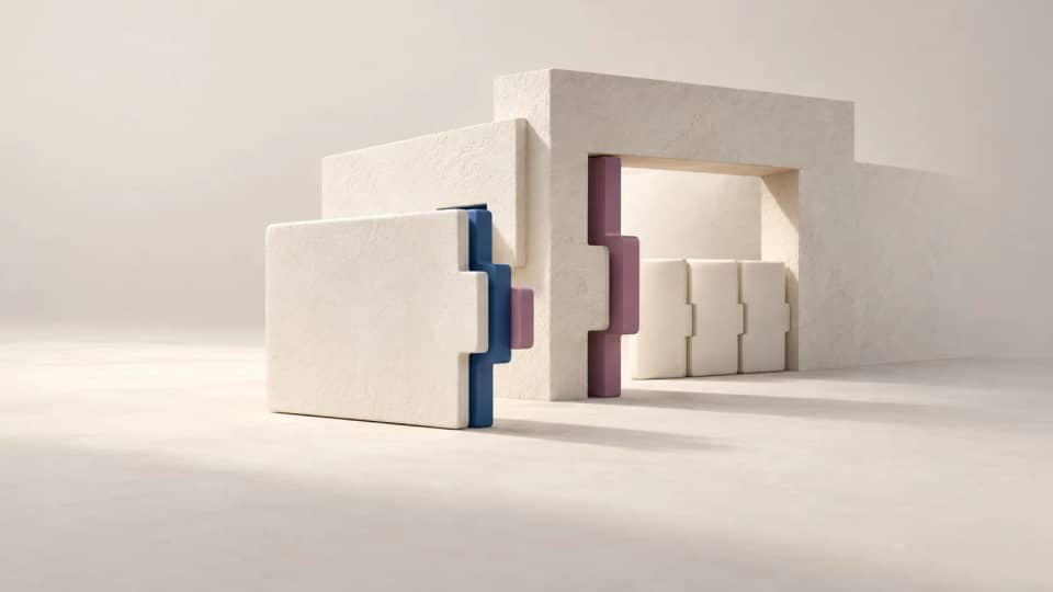 An ivory replacement tile fits a blue aperture but remains unseated at a second mauve keyed opening.