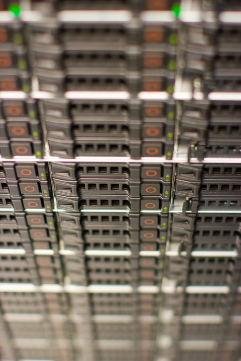 Server racks in a data center, illustrating the physical constraints behind AI reliability (power and cooling).